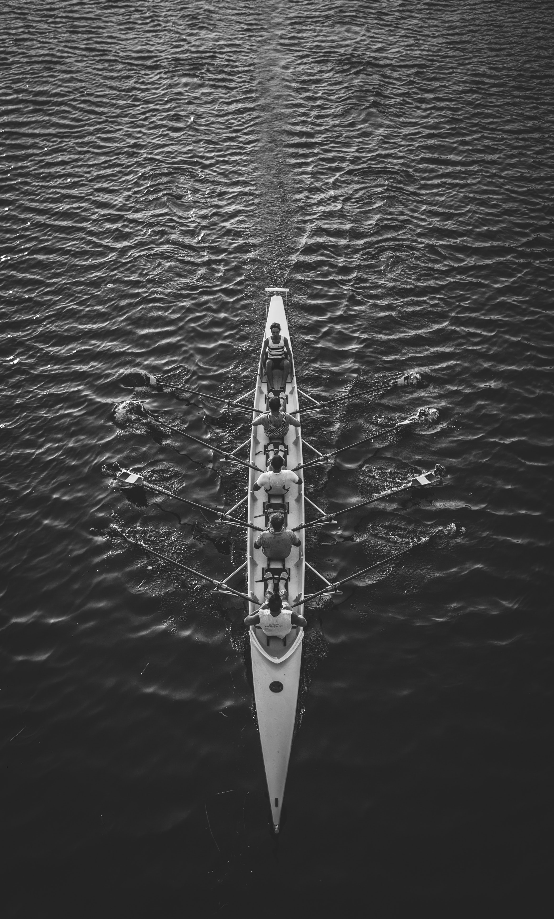Aerial view of an eight-person rowing crew in perfect synchronization